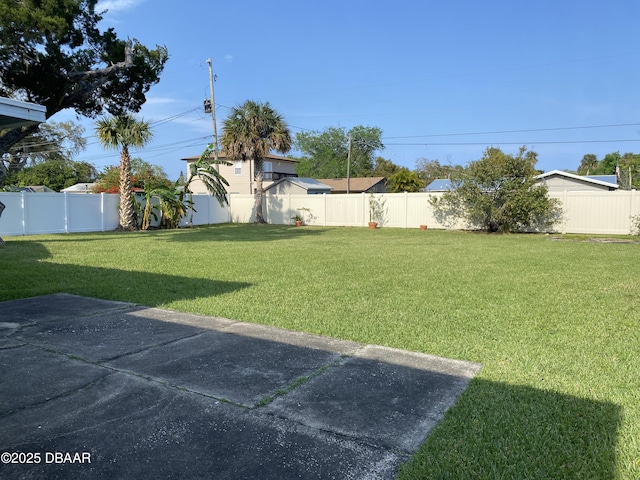 view of yard with a fenced backyard