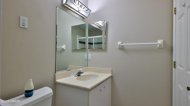 51 Bay Pointe Dr, Ormond Beach, FL 32174 - bathroom featuring vanity and toilet