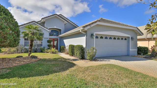 single story home with a garage and a front yard