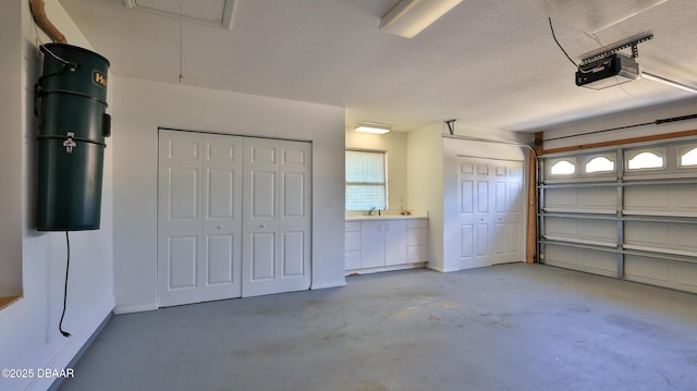 51 Bay Pointe Dr, Ormond Beach, FL 32174 - garage featuring a garage door opener and sink