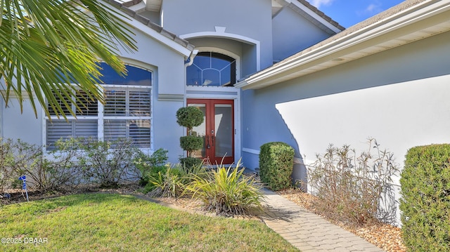 51 Bay Pointe Dr, Ormond Beach, FL 32174 - view of exterior entry featuring a lawn