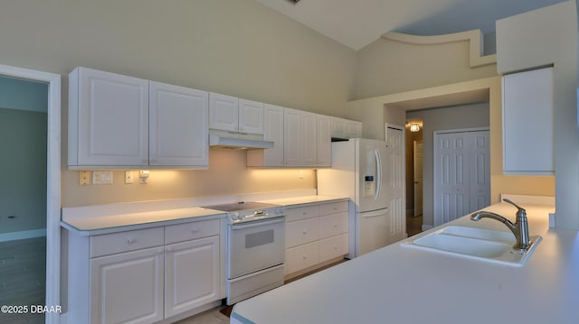 51 Bay Pointe Dr, Ormond Beach, FL 32174 - kitchen featuring white appliances, high vaulted ceiling, sink, and white cabinets