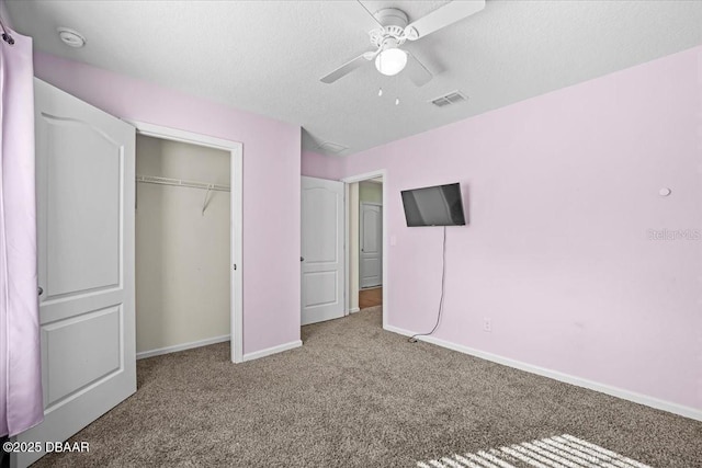 20 Sand Wedge Ln, Bunnell, FL 32110 - unfurnished bedroom featuring carpet floors, baseboards, a closet, a textured ceiling, and a ceiling fan
