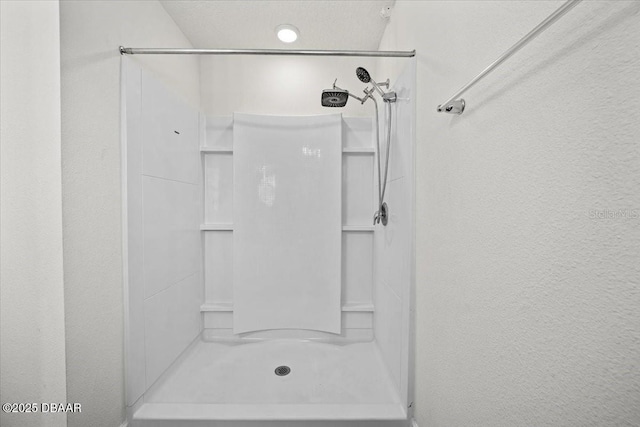 20 Sand Wedge Ln, Bunnell, FL 32110 - full bathroom featuring a stall shower and a textured wall
