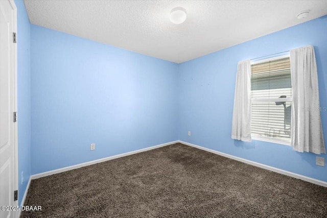 20 Sand Wedge Ln, Bunnell, FL 32110 - spare room with dark colored carpet, baseboards, a textured ceiling, and a smoke detector
