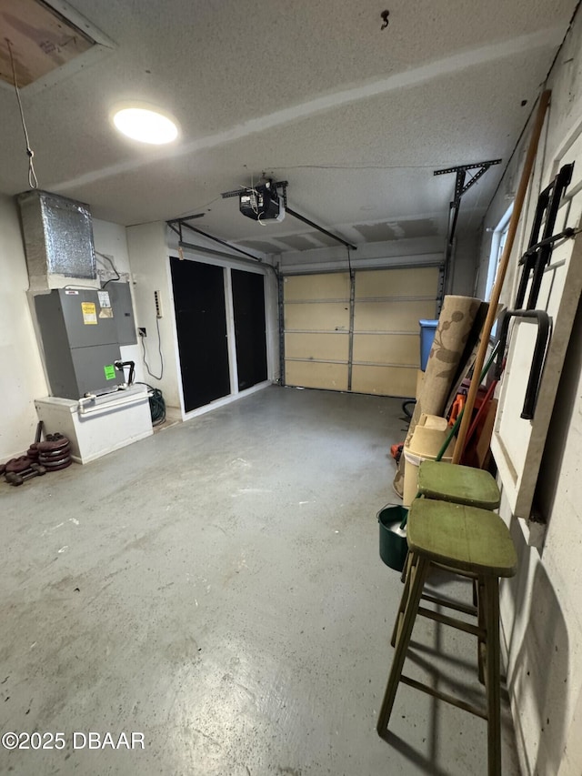 garage featuring a garage door opener and electric panel