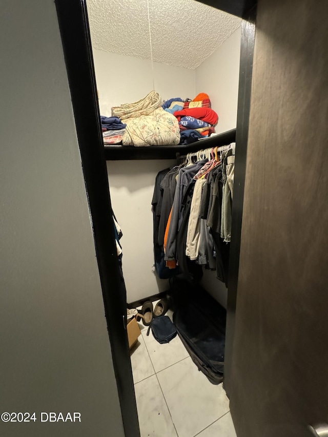 walk in closet featuring light tile patterned floors
