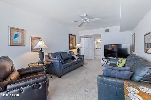 living room featuring light carpet and ceiling fan