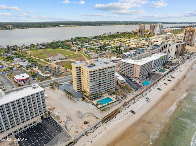 aerial view of a nearby body of water and a pool area
