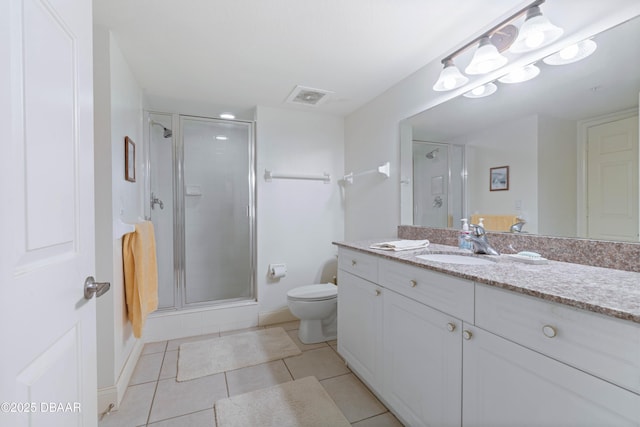 bathroom featuring toilet, a stall shower, tile patterned floors, and vanity