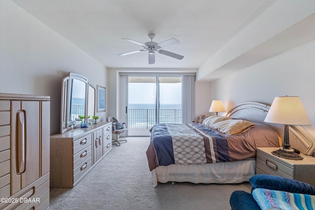 carpeted bedroom featuring access to outside and ceiling fan