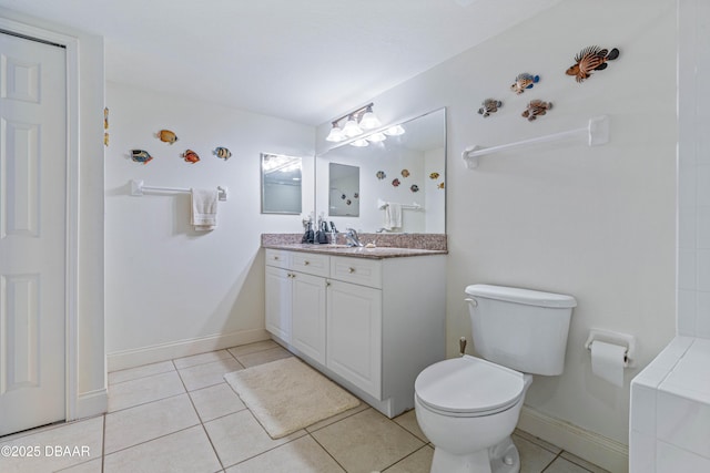 full bath with tile patterned flooring, toilet, vanity, and baseboards