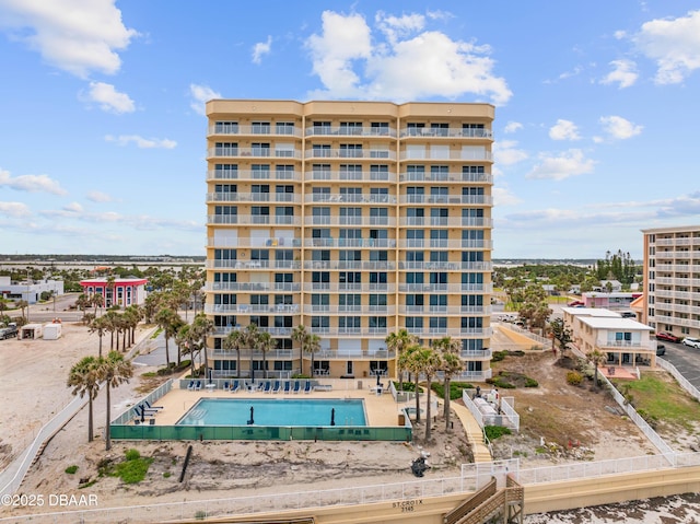 view of apartment building / complex with a community pool