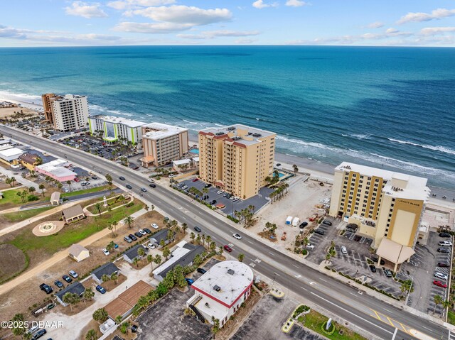 bird's eye view of a nearby body of water and apartment complex / building