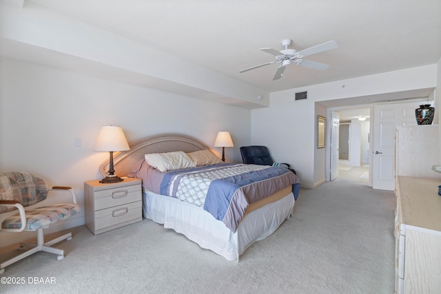 bedroom featuring light colored carpet and ceiling fan
