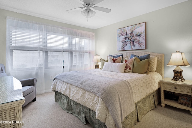 bedroom with light colored carpet and ceiling fan