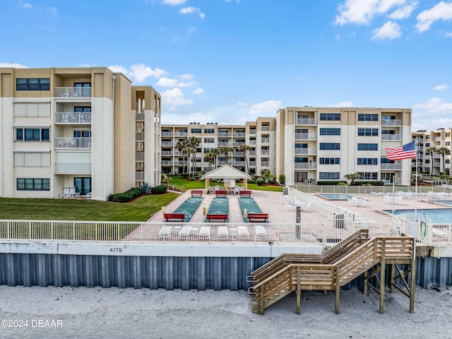 view of building exterior with a community pool