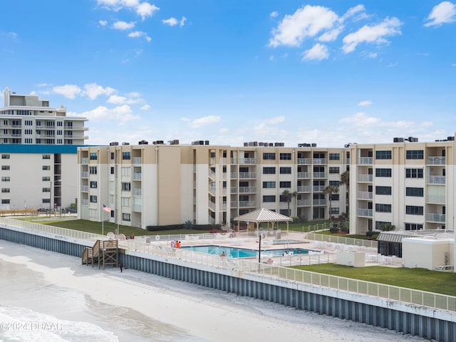 view of building exterior with a community pool