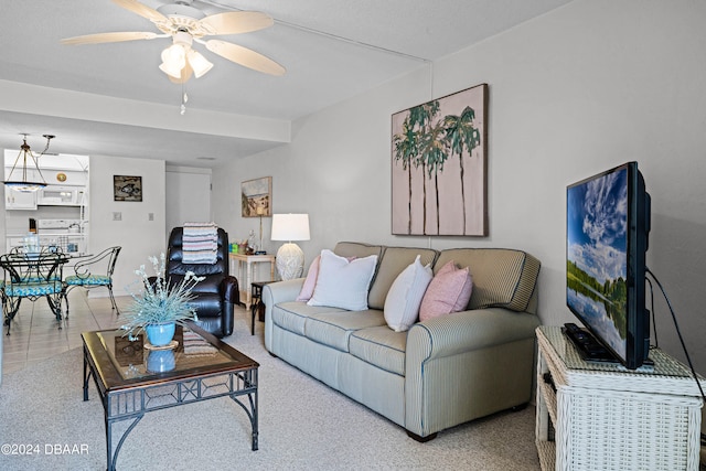 carpeted living room featuring ceiling fan