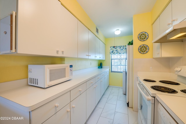 kitchen with white cabinetry and white appliances