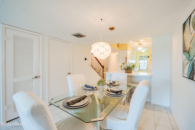 dining area with ceiling fan