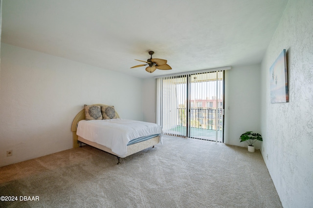 carpeted bedroom featuring ceiling fan and access to outside