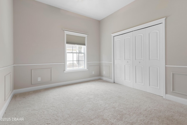 46 Audubon Ln, Flagler Beach, FL 32136 - unfurnished bedroom featuring carpet, a closet, and baseboards