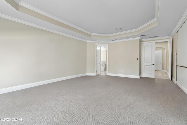 46 Audubon Ln, Flagler Beach, FL 32136 - carpeted spare room with a raised ceiling, crown molding, baseboards, and arched walkways