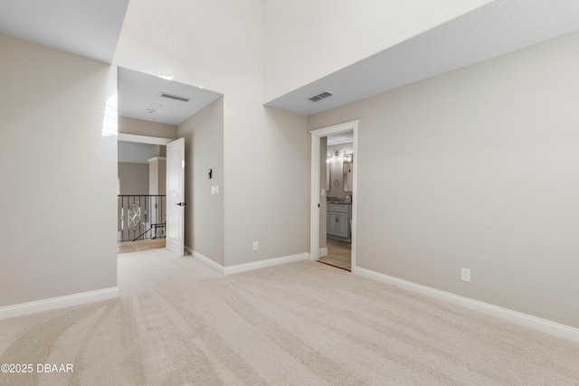 46 Audubon Ln, Flagler Beach, FL 32136 - empty room featuring light colored carpet and baseboards