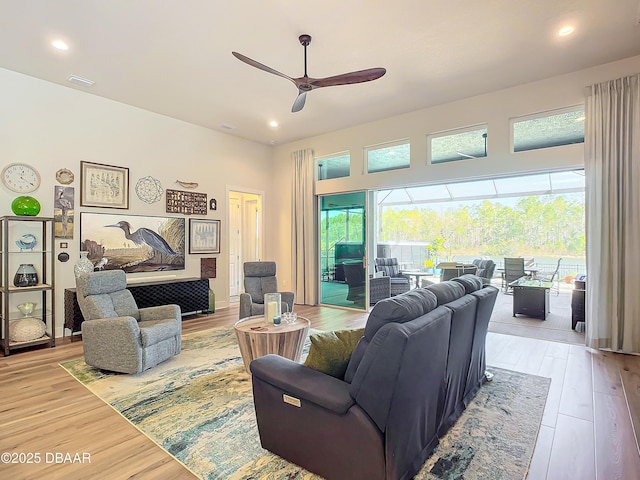 living area featuring recessed lighting, visible vents, ceiling fan, and light wood finished floors