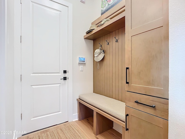 mudroom with light wood-style floors