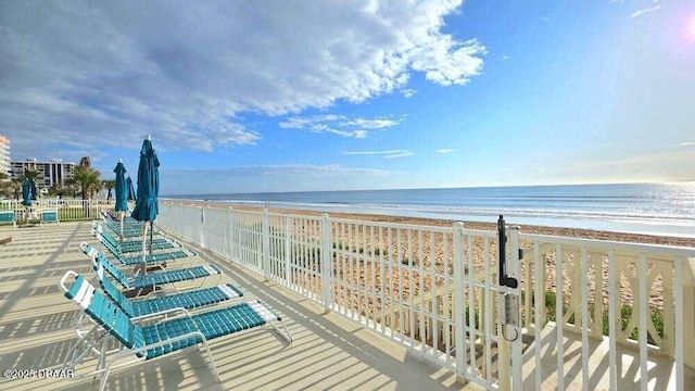 1133 Ocean Shore Blvd Unit 506, Ormond Beach, FL 32176 - balcony featuring view of water and beach