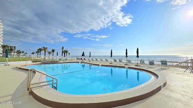 1133 Ocean Shore Blvd Unit 506, Ormond Beach, FL 32176 - community pool featuring a water view and a patio area