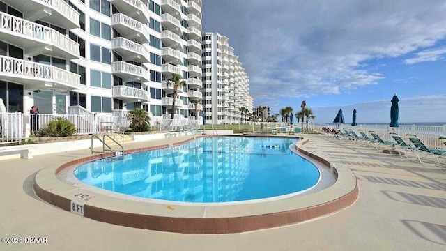 1133 Ocean Shore Blvd Unit 506, Ormond Beach, FL 32176 - community pool with a patio