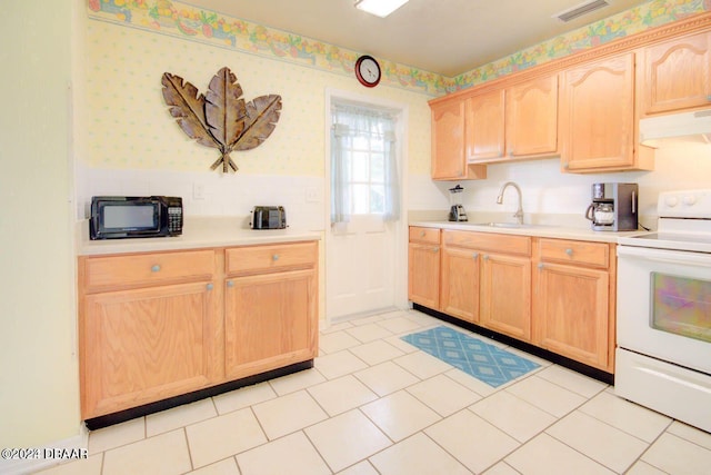 kitchen with white range with electric cooktop, sink, light tile patterned floors, and light brown cabinets