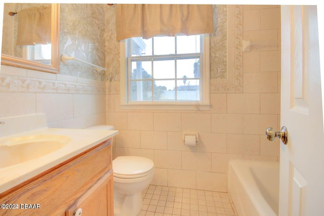 full bathroom featuring vanity, tile walls, independent shower and bath, tile patterned flooring, and toilet