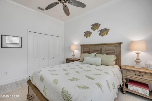 3017 Glin Cir, Ormond Beach, FL 32174 - bedroom featuring a closet, crown molding, light wood finished floors, and ceiling fan