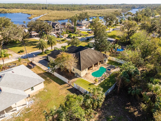 birds eye view of property with a water view