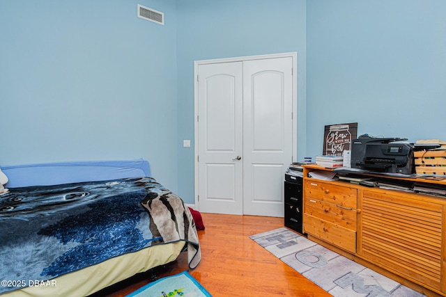 bedroom featuring a closet and hardwood / wood-style floors