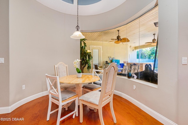 dining area featuring hardwood / wood-style flooring, ceiling fan, and wood ceiling