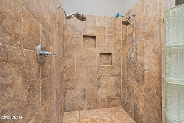 bathroom with a tile shower