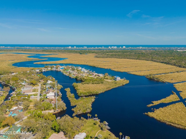 birds eye view of property with a rural view and a water view