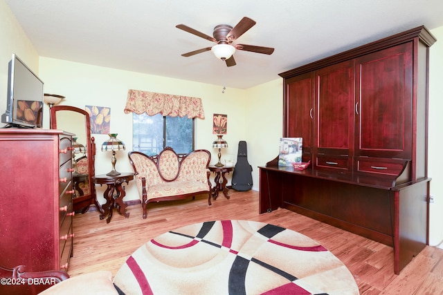 office space featuring ceiling fan and light hardwood / wood-style floors