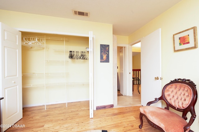 sitting room featuring hardwood / wood-style flooring