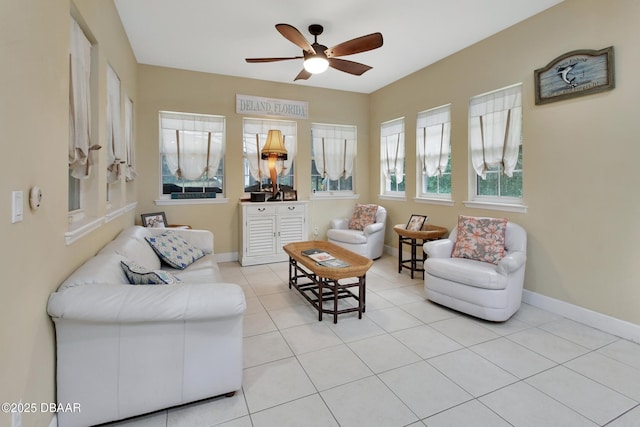 sitting room with light tile patterned floors and ceiling fan