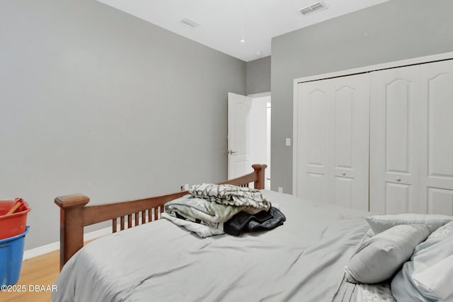 bedroom featuring a closet and light wood-type flooring