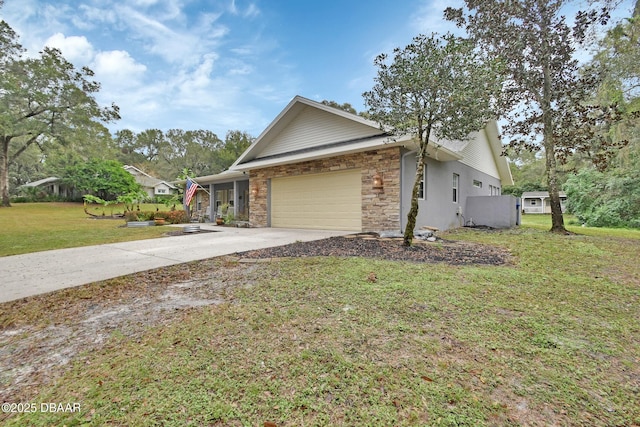 view of front of house with a garage and a front lawn