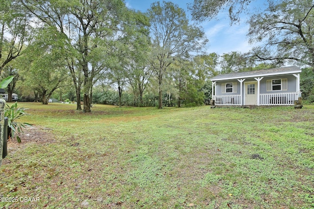 view of yard featuring covered porch