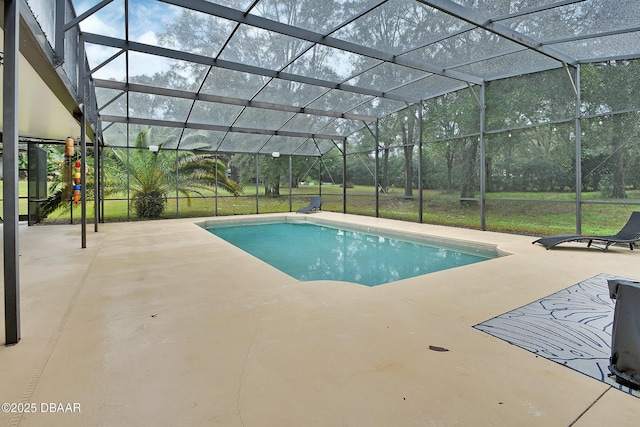 view of swimming pool featuring a patio and glass enclosure