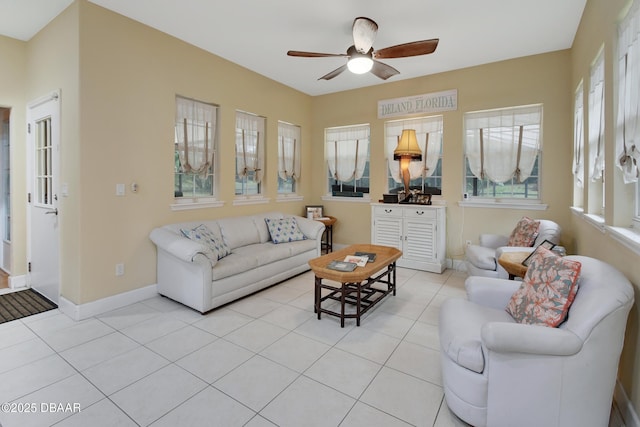 living room featuring ceiling fan and light tile patterned flooring